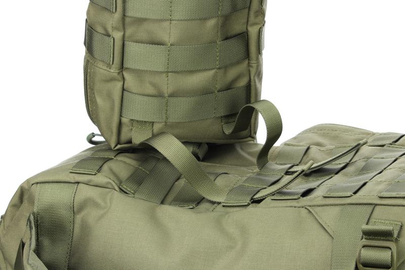 The straps on the back of the bag are pulled through the first strap loop of the backpack.