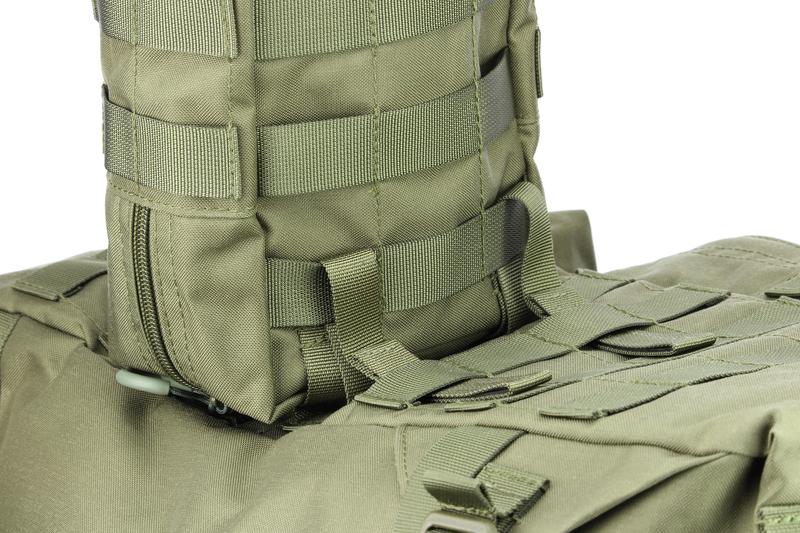 The webbing of the pouch is pulled through the second loops on the backpack.